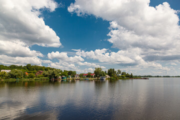 Fototapeta na wymiar beautiful summer view of the water, river, sea overlooking the blue sky with clouds