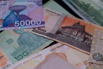 money from different countries in one pile close-up