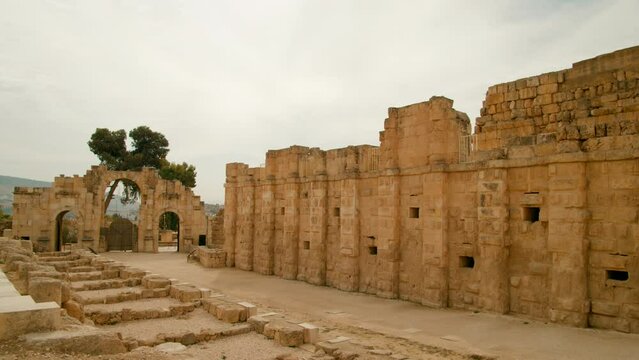 Ancient ruins presented in architecture in sunshine in Jerash, Jordan. Antique remains of Roman styled buildings in summer while visiting Middle East. Summer and travel. 4k panning shot