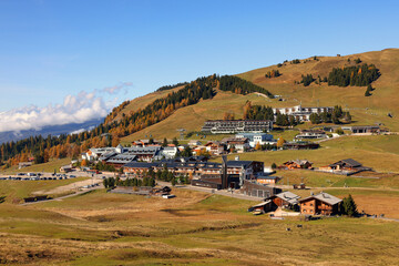 Obraz premium Majestic Alpe di Siusi mountain landscape. Summer hiking place with yellow dandelion flowers on the green fields, Dolomites, Italy, Europe