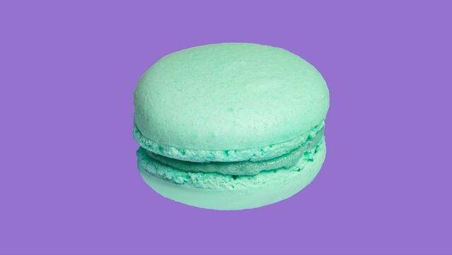 trendy food stop motion animation, sweet macaron cake of different colors on a purple background in pop art style