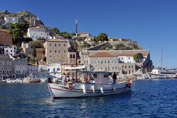 Fototapeta na wymiar Boat in the harbor at Hydra Port, Hydra, Greece