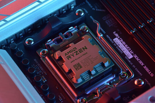 Close-up of an AMD Ryzen 9 3900X processor installed on a motherboard ASUS ROG STRIX X670E