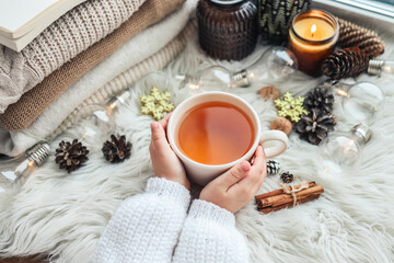 Cup of tea in hands, aesthetic winter photo