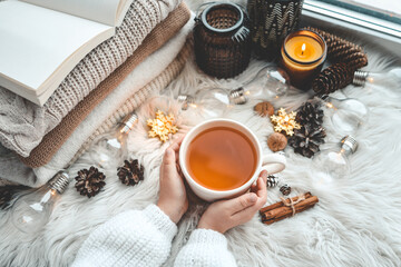 Cup of tea in hands, aesthetic winter photo