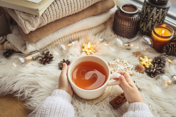 Cup of tea in hands, aesthetic winter photo