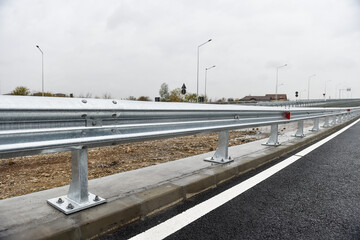 Brand new metallic road barrier for traffic safety on a new constructed road