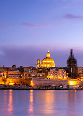 Fototapeta na wymiar Illuminated skyline of Valletta capitol of Malta at sunset