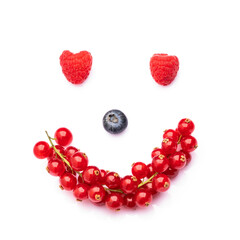 Raspberry, blueberry and red current on the white background