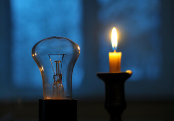 In the absence of electricity supply, a candle is lit