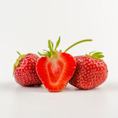 sliced freshly picked natural strawberries from the garden. highlighted on white.