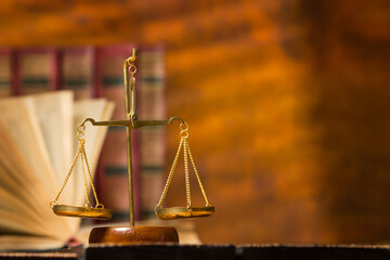 Law and justice concept. Mallet gavel of the judge, scales of justice, books. Copy space for text