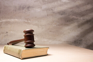 Law and justice concept. Mallet gavel of the judge, scales of justice, books. Copy space for text
