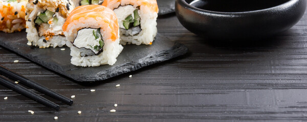 Philadelphia roll sushi with salmon, prawn, avocado, cream cheese. Sushi menu. Japanese food.