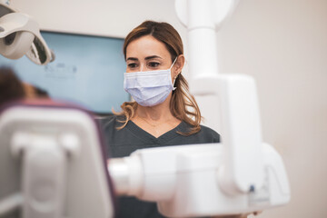 Obraz na płótnie Canvas A Female dentist doing a dental examination research study using X-rays in dentistry.Modern dentistry.