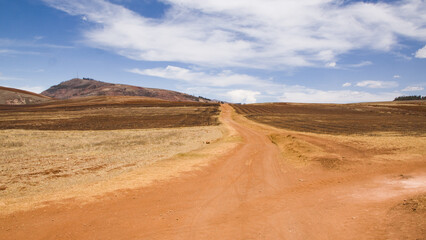 Fototapeta na wymiar Dry andean landscape with dirt road going nowhere Cusco, Peru