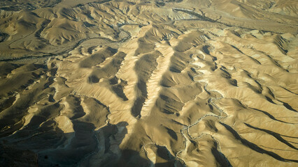 Gorgeous aerial drone top bird's eye view of incredible golden  desert mountains of tzin river. desert in Israel