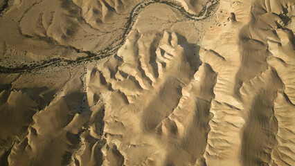 Gorgeous aerial drone top bird's eye view of incredible golden  desert mountains of tzin river....