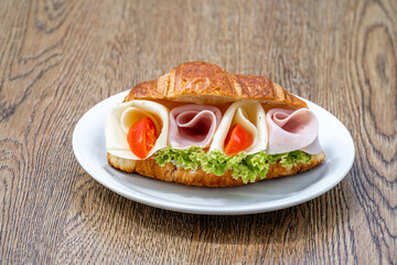 Croissant filled with ham, cheese and vegetables