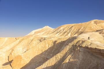 Gorgeous aerial drone top bird's eye view of incredible golden  desert mountains of tzin river. desert in Israel