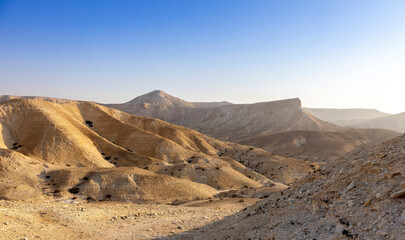 Gorgeous aerial drone top bird's eye view of incredible golden  desert mountains of tzin river. desert in Israel