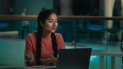 Happy arabian woman student businesswoman sit at shopping mall talk in video chat use laptop business online conference e-learning chatting distant job interview female freelancer communicate remote - Powered by Adobe