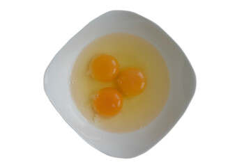 Raw eggs in a plate isolated on white background