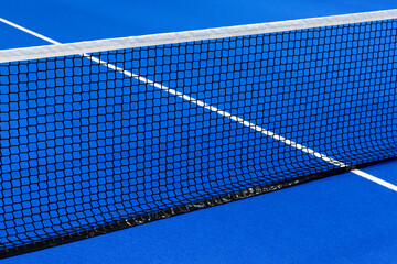 Paddle tennis and tennis net on blue court. Tennis competion concept. Horizontal sport poster,...