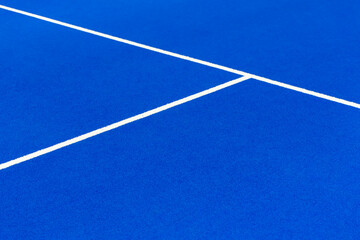 Blue paddle tennis court. Blue court with white lines. Horizontal sport poster, greeting cards, headers, website.