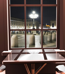 Exterior view through a restaurant window to the night street. 3d illustration.