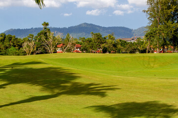 Lush golf fairways and greens in a tropical setting
