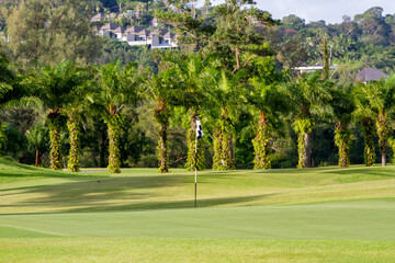 Lush golf fairways and greens in a tropical setting