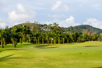 Fototapeta na wymiar Lush golf fairways and greens in a tropical setting