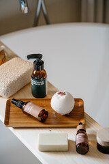 beauty products for skin care on wooden caddy in bathroom