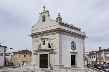 Obraz premium Chapel of Saint Goncalinho (Capela de Sao Goncalinho, built in 1714) - gleaming, white hexagonal chapel on Sao Goncalinho square. Chapel is named after Aveiro patron Sao Goncalinho. Aveiro, Portugal.