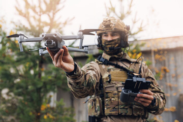 Modern army soldiers using aerial drone for artillery guidance and scouting view enemy positions in military operation - obrazy, fototapety, plakaty
