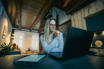 Young woman working from home office on new project development strategy