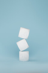 Marble tiles stacked in blue background, 3d rendering. Letter cubes with no sign, mock-up for abbreviations and signs