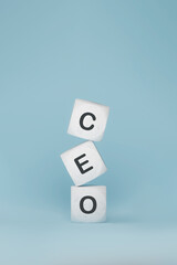 Marble tiles with CEO abbreviation stacked in blue background, 3d rendering. Letter cubes with mock-up with corporate business sign