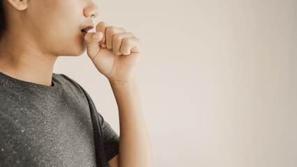 Close up of teen boy coughing from cold and flu,COPD, pneumonia, bronchitis, asthma, allergy, respiratory illness concept - obrazy, fototapety, plakaty