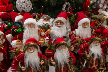 Lot of Santa Claus toys in market at Christmass holidays, winter traditions and celebration