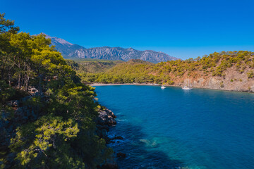 Fototapeta premium Concept cruise travel summer Turkey. Aerial view white yacht on clear blue sea in beautiful lagoon