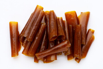 Dried mango paste sheets on white background.