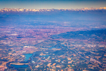 Fototapeta na wymiar Panoramic aerial view of Turin and snowcapped mountains in Piedmont, Italy