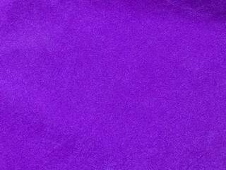 Purple velvet fabric texture used as background. Empty purple fabric background of soft and smooth textile material. There is space for text.