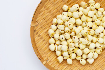 Dried lotus seeds on white background.