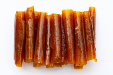 Dried mango paste sheets on white background.