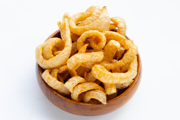 Fried crispy pork rinds on white background.