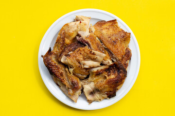 Grilled chicken, Thai style food on yellow background.