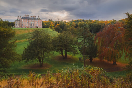 Stately home and manor Dalkeith Palace amongst autumn colours at Dalkeith Country Park a popular day trip from Edinburgh, Midlothian, Scotland.